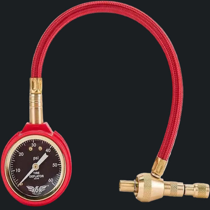 Red hose tire deflator gauge for offroad vehicles, essential tool for Lebanon drivers.