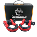 Two red and black heavy-duty vehicle snatch blocks displayed in front of their black and orange GearAmerica retail packaging box on a white background.
