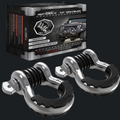 Two black and silver shock absorber assemblies displayed in front of their black and silver Autracq 3/4 Shock Absorber retail box on a solid white background.