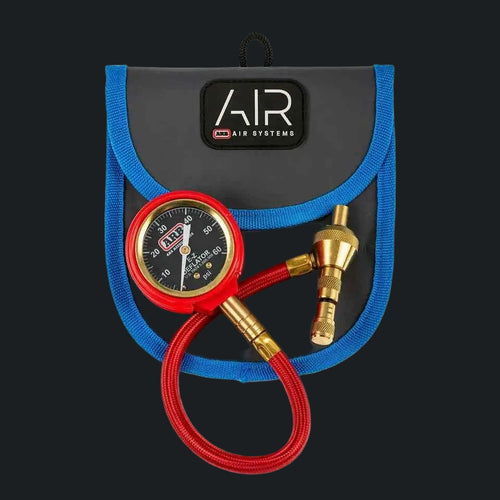 Tire deflator with PSI gauge and red hose in a travel pouch for offroad use in Lebanon