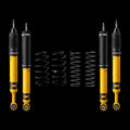 A set of four yellow and black K&N brand suspension shock absorbers and four black coil springs, arranged symmetrically on a plain white background.