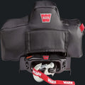 Black winch cover with red WARN logo for offroad vehicles, suitable for Lebanon.